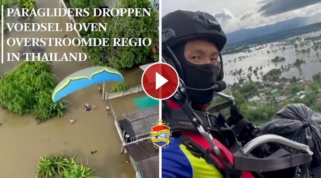 Paragliders droppen voedsel boven overstroomde regio’s in Thailand