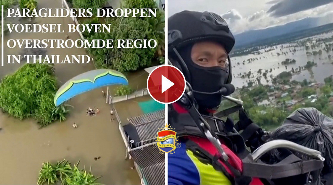 Paragliders droppen voedsel boven overstroomde regio’s in Thailand