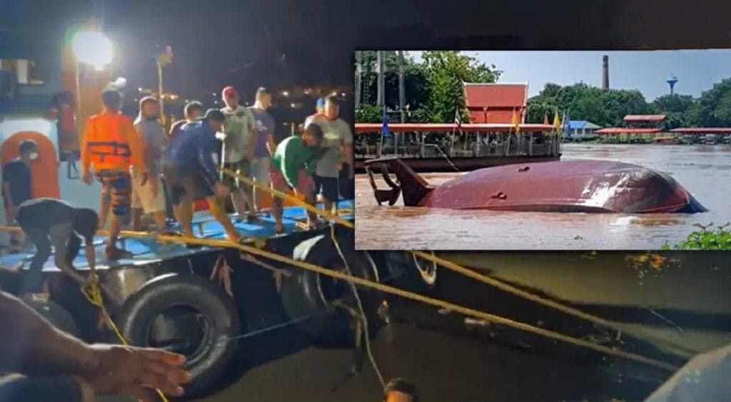 Reddingswerkers vinden het lichaam van de kapiteinsvrouw van de gezonken riviersleepboot in Ayutthaya