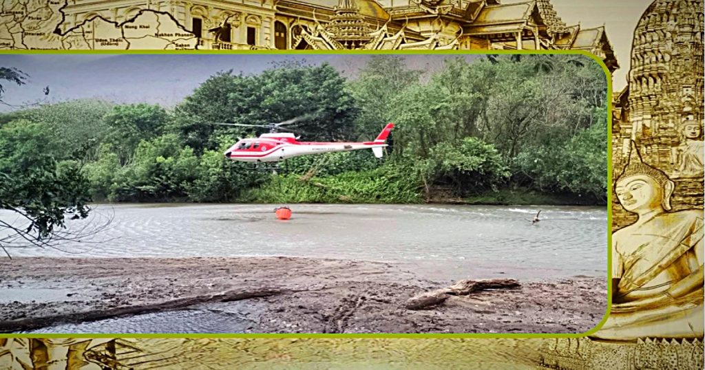De brandweerlieden weten met behulp van helikopters de enorme bosbrand in Chiang Mai te bedwingen 