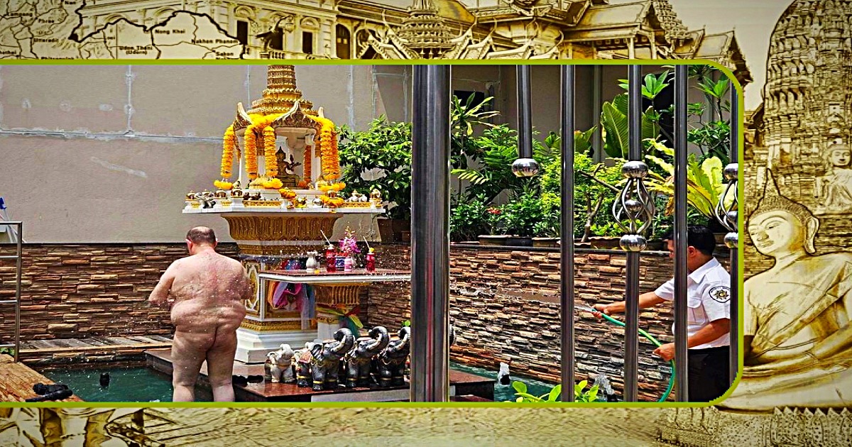 Dikke farang kleedt zich uit en poept bij een shrine in Bangkok 